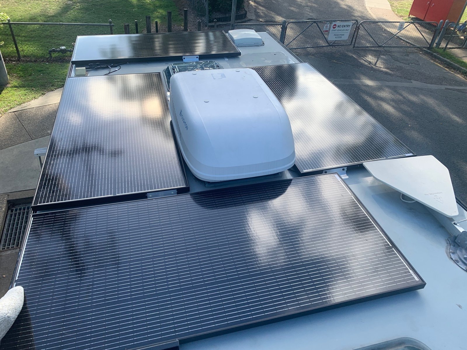 Caravan roof solar panels installed around roof vents